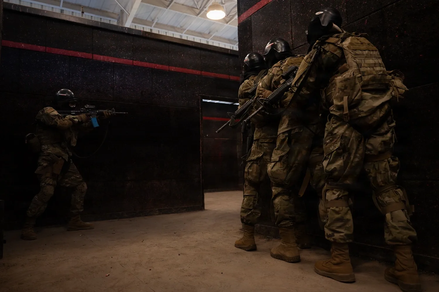 Team stacked on the wall while the point clears the doorway (U.S. Air Force photo, DVIDS)