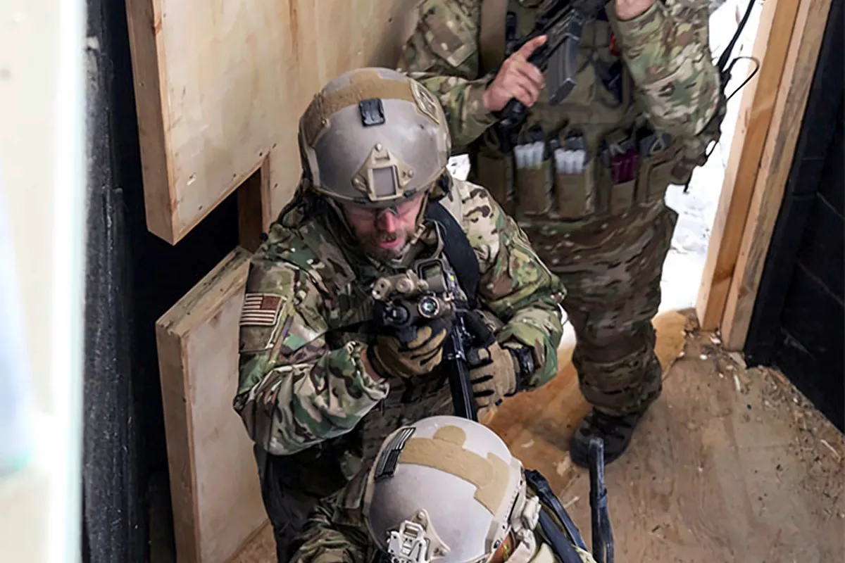Team stacked and moving through a doorway during CQB training (U.S. Army photo)