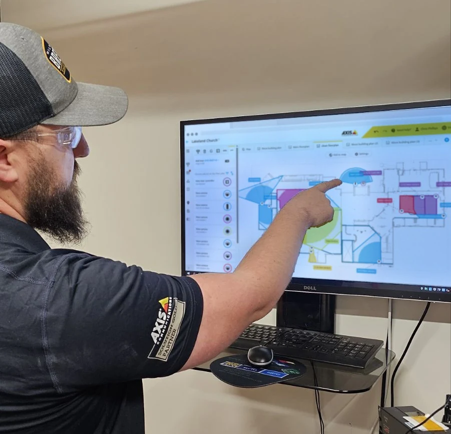 AdvaTech technician reviewing an Axis Site Designer camera layout