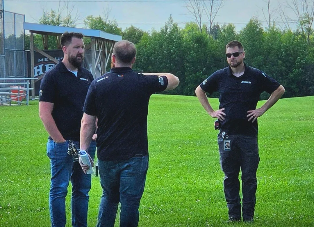 Three AdvaTech team members standing outdoors